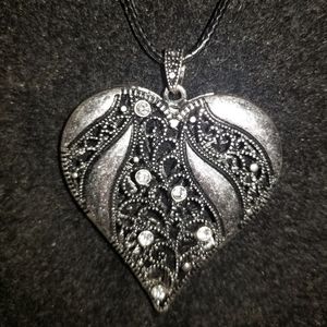 Beautiful long rope necklace with heart pendant.